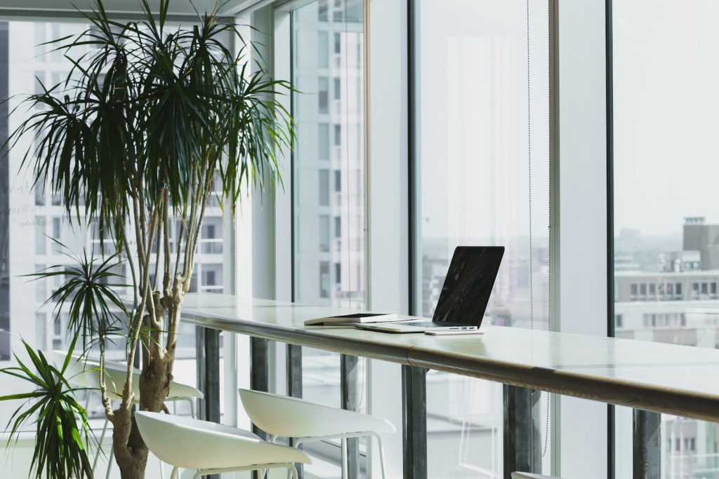 Professional office desk with a laptop representing Court of Protection administration