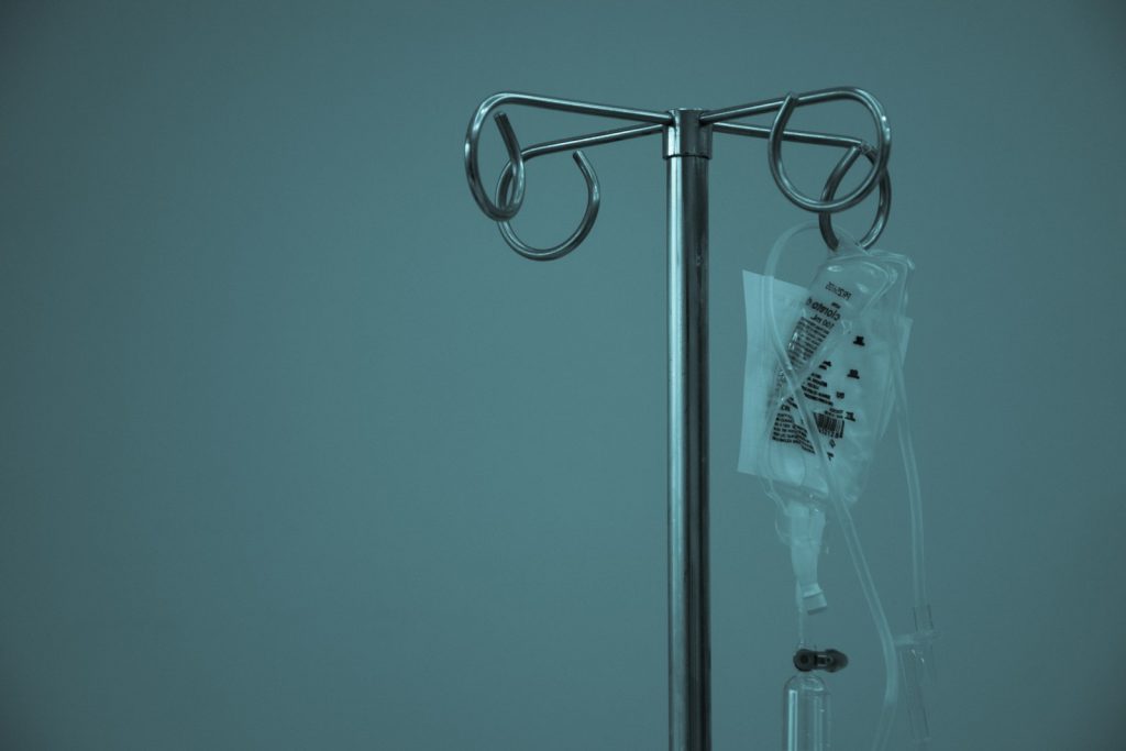 Hospital intravenous drip stand representing serious injury care